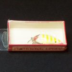 The hang tab use added to the basic shrink wrap box to allow them to be displayed on peg hooks. The changed to the the red card bubble pack card in about 1973.