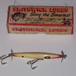 This is a beauty It is stamped DEVEL Horse. It has the split ring on the line tie. It comes in the older two piece box which is 1 1/4" deep and is stamped L-119 DEVELS Horse Floater. It is color # 19 and is what I would call a Brown Scale. I only have one DEVELS color chart where the numbers extend above 16 and that is the chart which I believe is 1962 and it has 22 colors. Color #19 does not show on the chart. It skips from 17 to 22. I believe this lure is from 1956 to 1962..