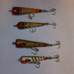 The first two lures are Devils Warhorse lures. The first one is 2 3/4" long and has the Carrot Top look with a slightly taperd head and a slightly concave front. The second one is 2 1/2" long with a rounded head. The next two are Devels Warhorse lures. The third one down is 2 3/4" long and has no taper on the head and a flat face. The last one is 2 1/4" long with a semi rounded head and a small flat face. Rather curious that the Devils and the Devels had both the smaller size with the rounded