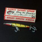 B-900 MA Scooter - Devils Horse. The Ma Scooter has a 3 3/4" wood body which is flat on the bottom. It has one small rounded spinner on the rear. It has two hooks.