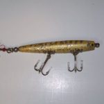 F-1000 Popper - Devils Horse . It uses the F-100 blank.
This lure never made it into the color charts. It is shown in Adrien Delbasty's Reference book. This one is in color # 3 Silver Minnow. The ones shown in Adrien's book have a lead weight on the tail. This one has the ball weight. It also has split rings on each of the hooks as they attach to the hook hangers
