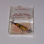 S-300 Race Horse V2
This lure is in a hard plastic box. It has the large ball weight in the front and a small ball weight in the back. It is in color # 5 Yellow with Black Stripe.