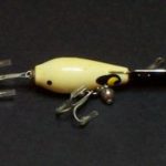 A-700 Rooter Jr. - Devils Horse, I first see this lure in about 1963. It does not have the ball weight. Then later in the 1960's it acquires the ball weight. In 1977 it seems to have lost the ball weight at some point in it's history and this continues into the late 1980's. Started out in wood and later was plastic.
I first see this lure in about 1963. It does not have the ball weight. Then later in the 1960's it acquires the ball weight. In 1977 it seems to have lost the ball weight at some point in it's history and this continues into the late 1980's. This lure is plastic. It is Color: # 2 White.