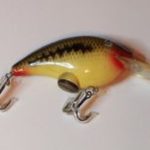 B-4000 Blinker
The Blinker was introduced and advertised in 1977 and 1978. Check out the ads in the section on advertising on this website. They were discontinued by the early 1980's. It has a battery inside which allows the eyes to light up when fished. This one is in the color # 92 Baby Bass.