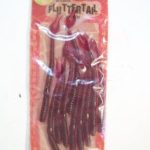 Flutter tail Worms.
This is a package of 10 5 1/2" grape colored worms. They are the standard Fluttertail body and tail design. The package has the Championship Tackle name on it. It also has a round sticker on the upper left of the package. It is faded but you can still see the Smithwick "Red Rearing Horse" on it.