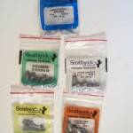 Smithwick brand Sinkers. 
Smithwick brand sinkers first show up in the 1978 catalog and discontinued in the 1984 catalog. This grouping contains: Size 6 Bass Casting Sinkers, Size 0 Rubber Grip Sinkers, Size 10 Egg Sinkers, Size 6 Pinch Sinkers, and Size 0 Worm Sinkers.