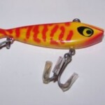 A-1300 Water Gater
The A-1300 is the smaller one. It is 2 1/2" long and is 1/4 oz. Color: #48 Coach Dog - Red and Yellow.